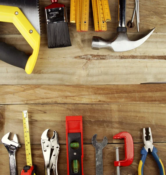 Assorted work tools on wood Stock Photo