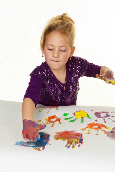 Child painting with finger paints — Stock Photo, Image