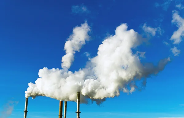 Smoking chimneys of a factory — Stock Photo, Image