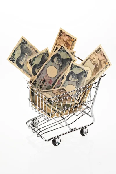 Japanse yen bill met winkelmandje — Stockfoto