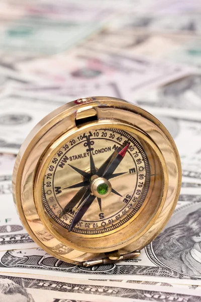 Dollar currency notes and compass — Stock Photo, Image