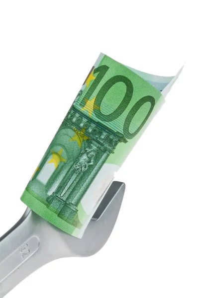 Інструмент і банкнота євро — стокове фото
