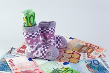 Children's socks and â‚¬ bills clipart