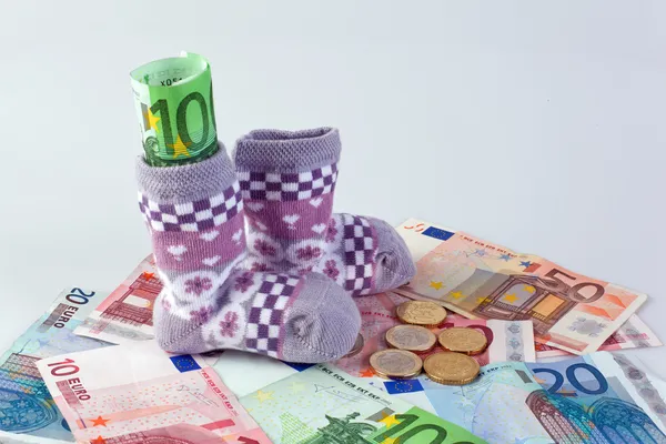 Children's socks and â‚¬ bills — Stock Photo, Image