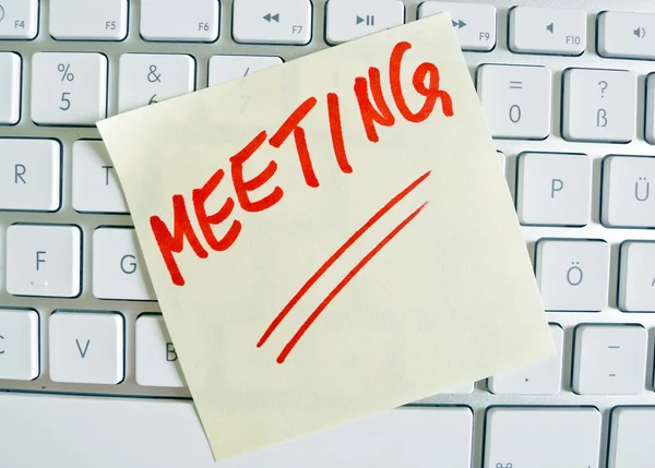 Note on computer keyboard: meeting — Stock Photo, Image