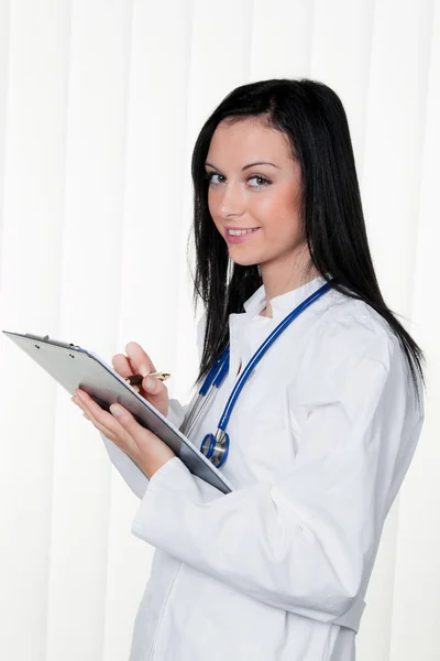 Doctor at the hospital and diagnostic krankenakt — Stock Photo, Image