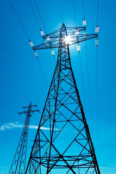 Power pole with the sun and sky — Stock Photo, Image