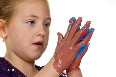 Child painting with finger paints clipart