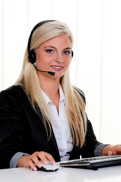 Woman with headset and computer hotline at — Stock Photo, Image