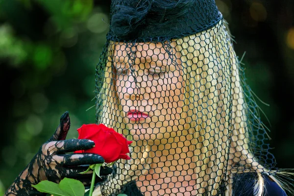 stock image Widow with a veil and rose