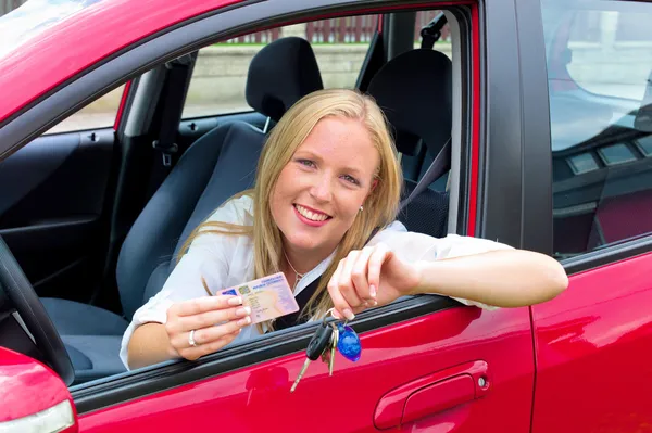 Young woman holding a driving license — Stock Photo, Image