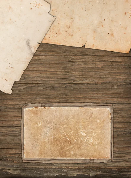 Aged papers on a dark wooden background — Stock Photo, Image