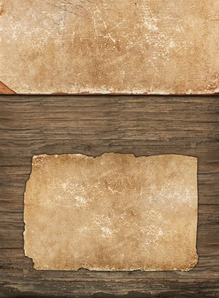 Weathered old papers on a wooden background — Stock Photo, Image