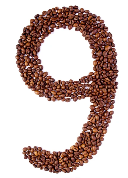 Kahve çekirdekleri arasında sayı 9. — Stok fotoğraf