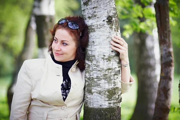 Woman embracing a birch — Stok Foto