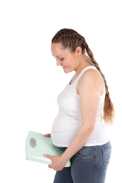 Hamile kadın, ölçekler, yalıtım — Stok fotoğraf