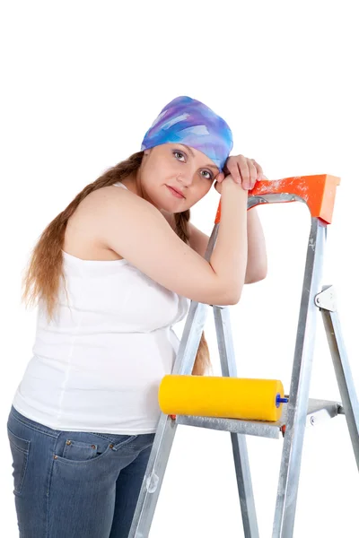 Tired pregnant woman after the repair, studio — Stock Photo, Image
