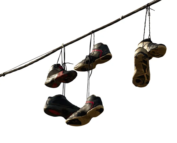 Πάνινα παπούτσια που κρέμονται σε μία τηλεφωνική γραμμή — Φωτογραφία Αρχείου