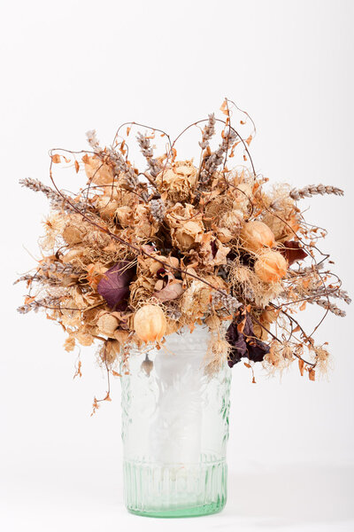 Dry flowers in a glass vase