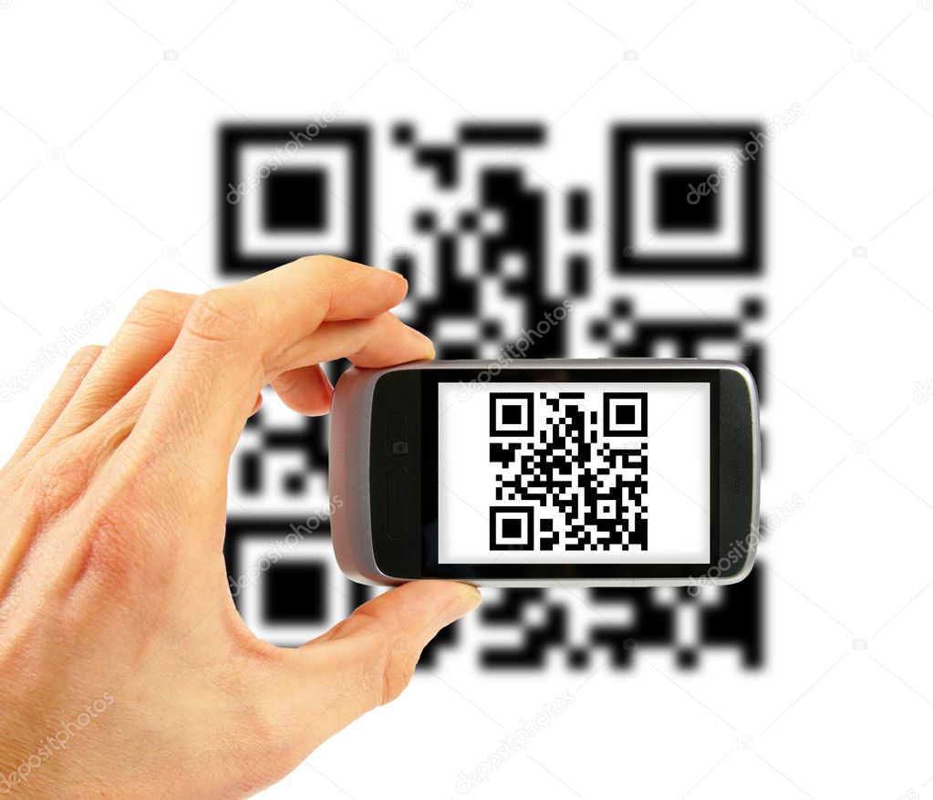 Hand with mobile phone scanning QR code