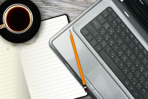 Werkplek met laptop, notitieboekje en koffie beker — Stockfoto