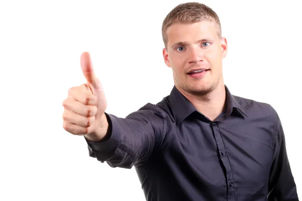 Smiling young man with thumb up — Stock Photo, Image