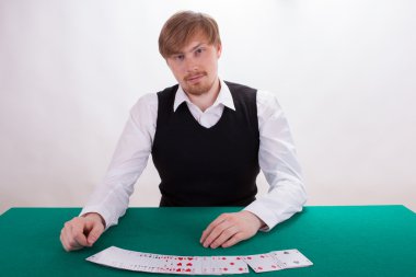 A young man is playing poker clipart