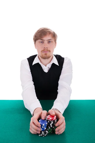 Молодой человек играет в покер Стоковое Изображение