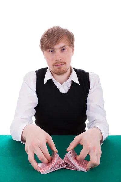 Молодой человек играет в покер Стоковая Картинка