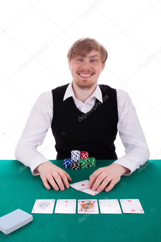 A young man is playing poker