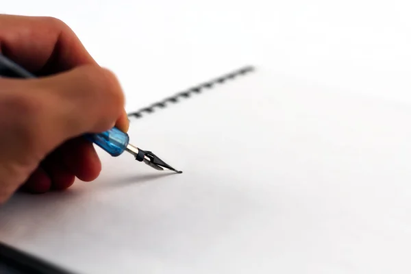 Stock image Writing on the notebook with pen