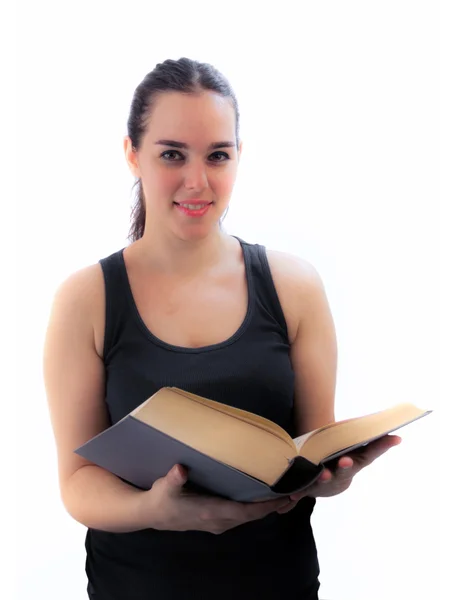 Молодая девушка-подросток, стоящая с открытой книгой, изолированная на белом — стоковое фото