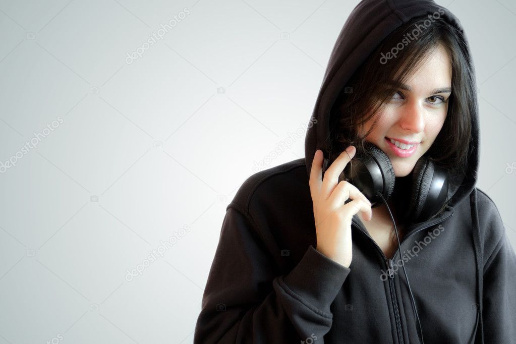 Beautiful Hip-Hop Style Girl Wearing a Hoddie Listening To Music