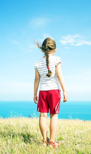 Girl in red shorts — Stock Photo, Image