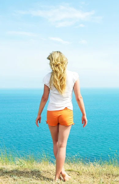 Girl in orange shorts — Stock Photo, Image