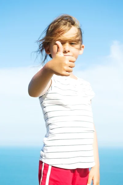 Girl shows a hand sign — Stock Photo, Image