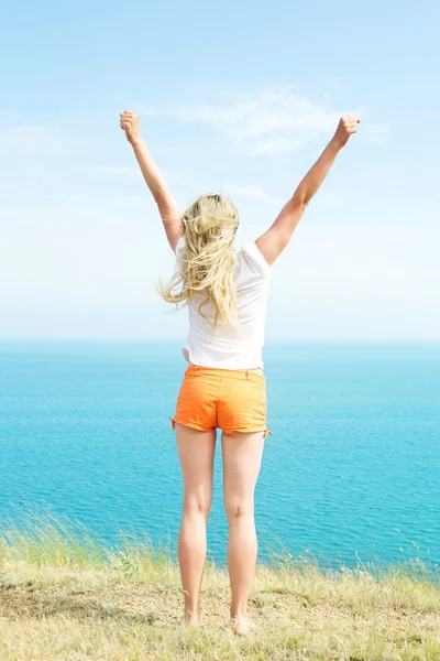Blond girl in shorts — Stock Photo, Image