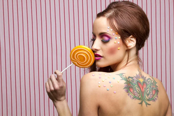 Godis, tatuering och lollipop — Stockfoto