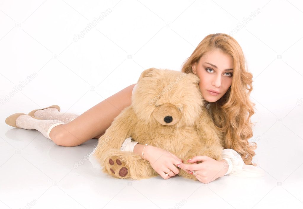 Lonely, tired girl hug the furry bear and relax