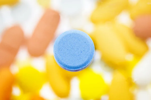 Blue pill with defocus background — Stock Photo, Image