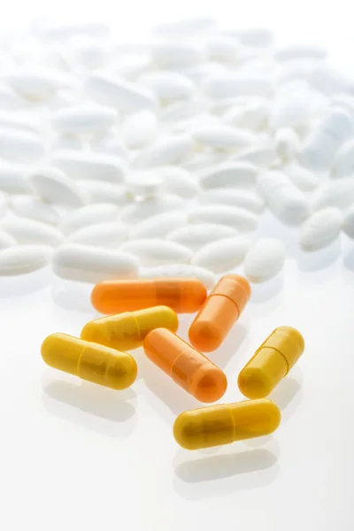 Yellow and orange capsules — Stock Photo, Image