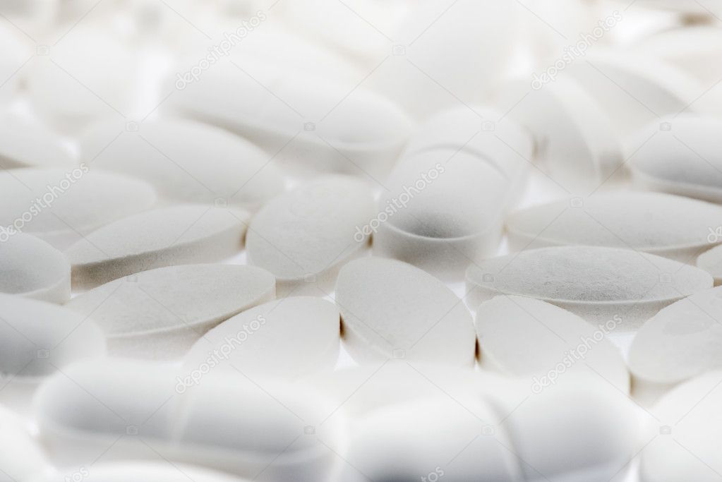 Various white pills with small DOF