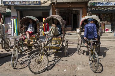 Rickshaw men is waiting for tourists clipart