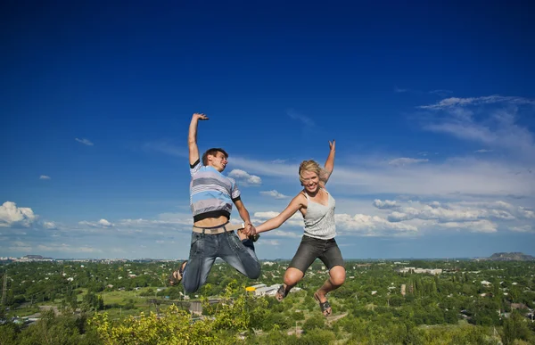 Boy and girl jumping — Stock Photo, Image