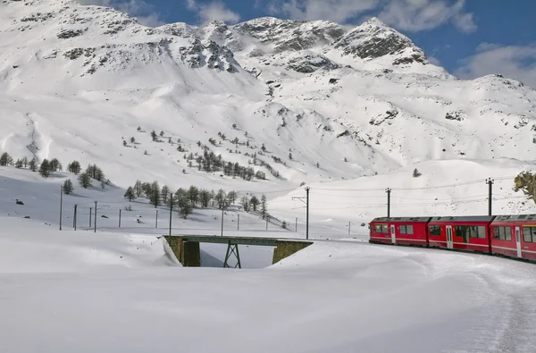 Red train and snow valley — Stock Photo, Image