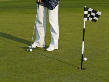 Golf training with ball and flag clipart