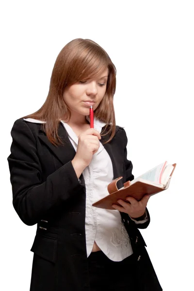 Isolated sexy business woman looking into diary — Stock Photo, Image