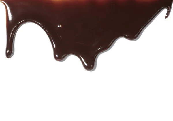 Шоколадный сироп просачивается жидкой сладкой пищи — стоковое фото