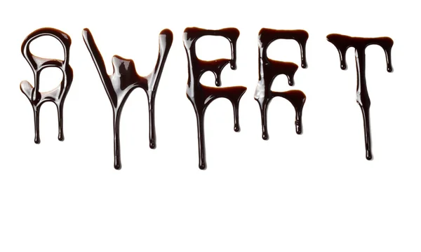 Chocolate syrup leaking liquid sweet food letters — Stock Photo, Image