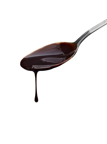 Spoon preperation kitchen tool food chocolate syrup leaking — Stock Photo, Image